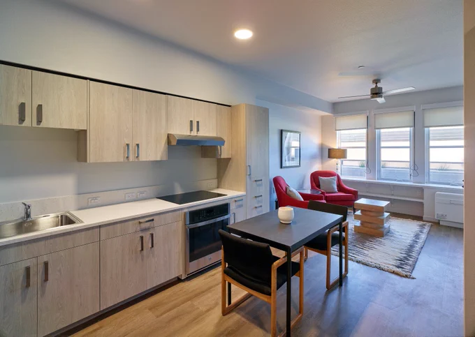 Photo of the interior of one of the units with a kitchen and living area