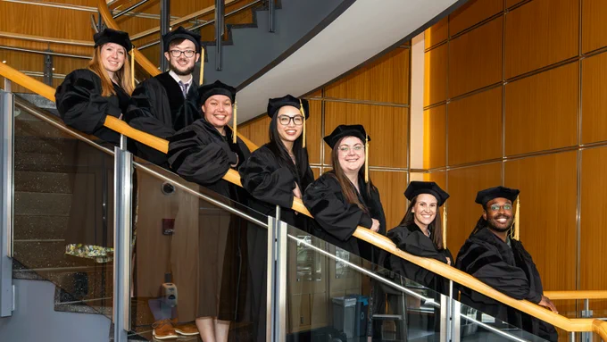 MD/PhD students in UMass Chan Medical School's Class of 2026 pose for a photo ahead of Commencement in the Lazare Research Building