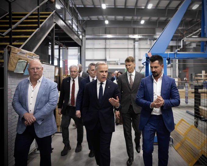 Prime Minister Carney touring a home manufacturing facility.