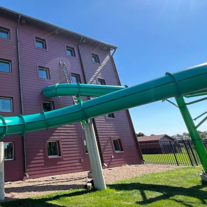 The green slide at the Family FunPlex has an outdoor segment as part of the many twists and turns.