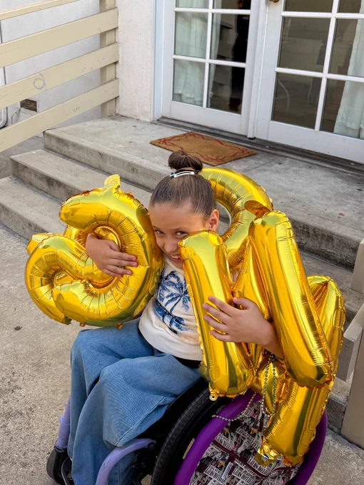 Bella with her celebratory balloons