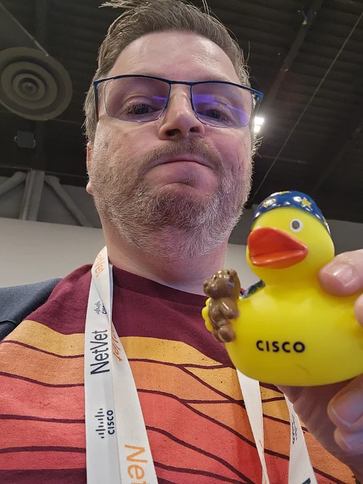 a bearded goober holding a rubber ducky