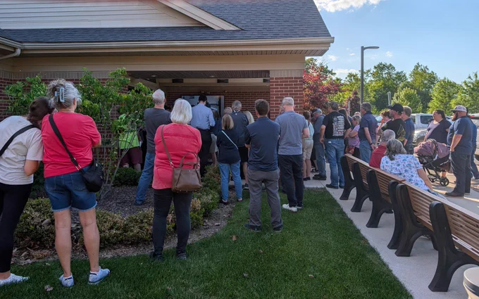 People gathered outside Lyon Twp building 