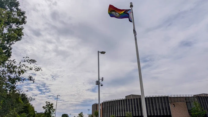 Pride Flag in front of HQ building in the park