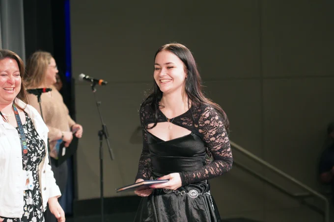adult student receives diploma at Bloomington Transition Center completion ceremony
