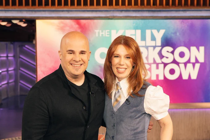 Image of Rhonda & Jason on set of The Kelly Clarkson Show smiling.