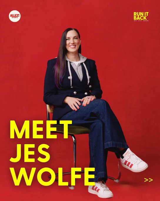 Run It Back carousel slide on a red background. Jes Wolfe sits on a chair in a navy blazer with silver buttons over a grey hoodie, dark jeans, and white Adidas sneakers with red stripes, smiling at the camera. Long dark hair with purple highlights. Bold yellow text reads "MEET JES WOLFE." Allez! Sports and Run It Back logos.
