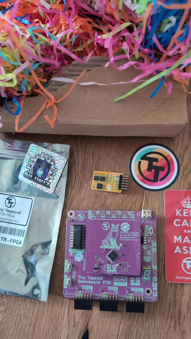 Small PC board with some stickers and colorful packing material 