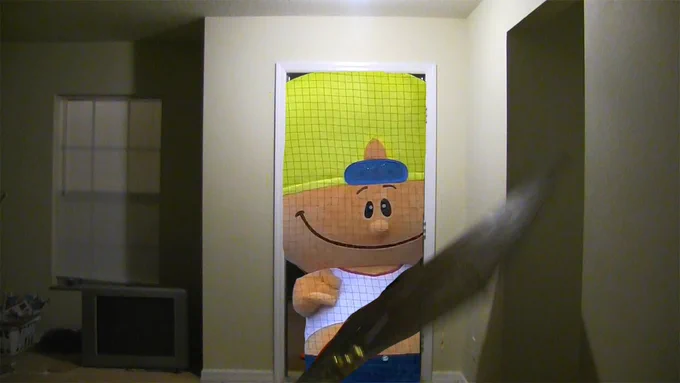 A smiling Pablo Sanchez appears in the dark. A door flies in front of him.