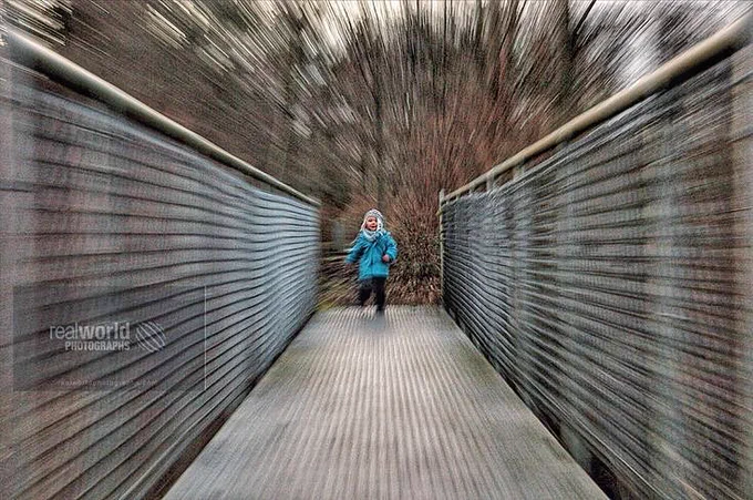 A toddler crosses a bridge in British Columbia, Canada. Gary Moore photo. Real World Photographs. #photography #Nikon #photojournalism #Canada #images #toddler #children #Grok #BritishColumbia #realworldphotographs #garymoorephotography #bridge #people #boy #places #stock #images