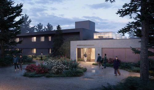 Modern building labeled "Anthropology & Sociology" at dusk, surrounded by lush greenery. People are walking along a path, creating a calm atmosphere.