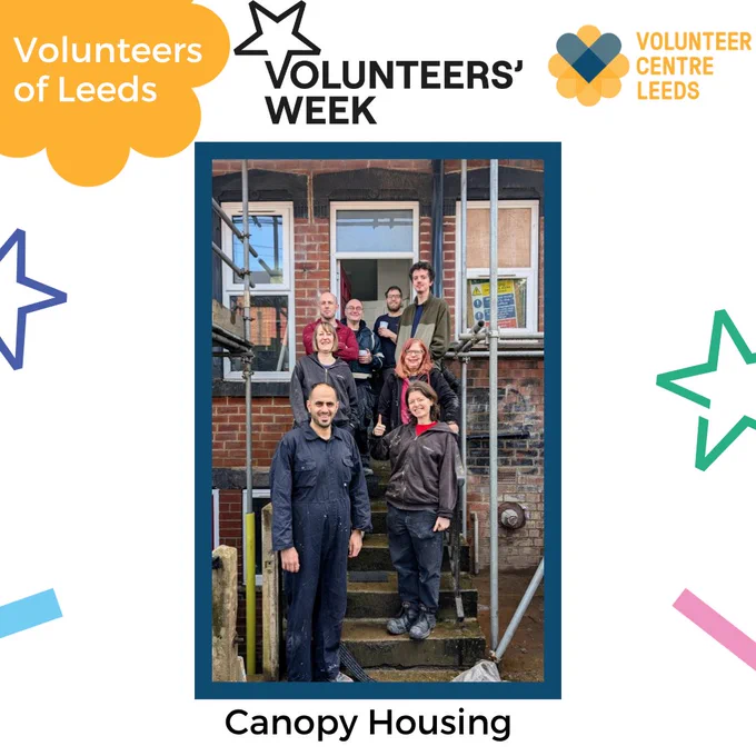 Group of seven people posing on outdoor stairs of a brick building for Canopy Housing during Volunteers' Week in Leeds.