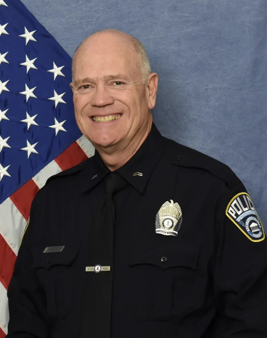 Formal headshot of Arlington County Police Corporal Barry Foust.