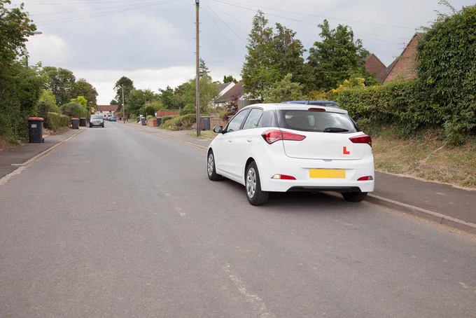 Leaner driver driving along residential road