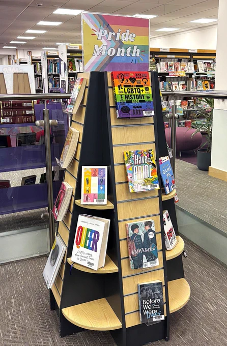 A Pride Month book display with a selection of LGBTQ  themed books.