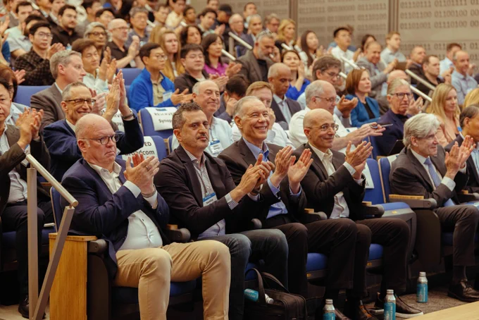Photo of a crowd clapping