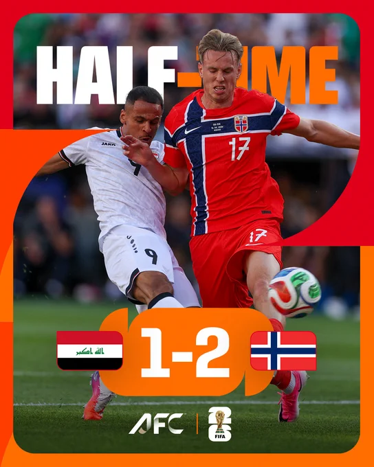 An intense soccer match between Iraq and Norway with a halftime score of 1-2. The mood is competitive, with players in action.