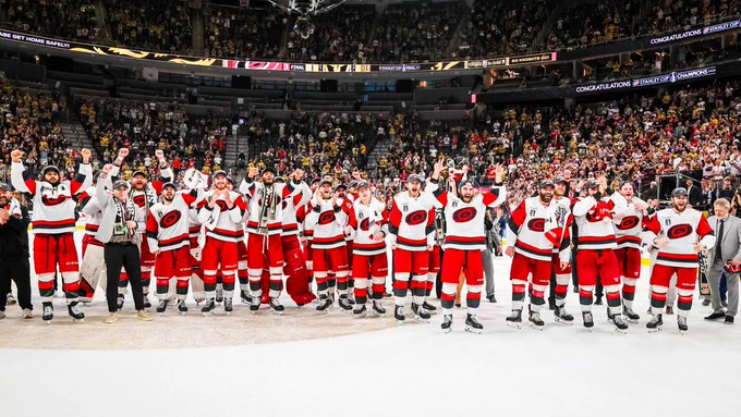 Photo of the Canes cheering on the ice after their Cup win