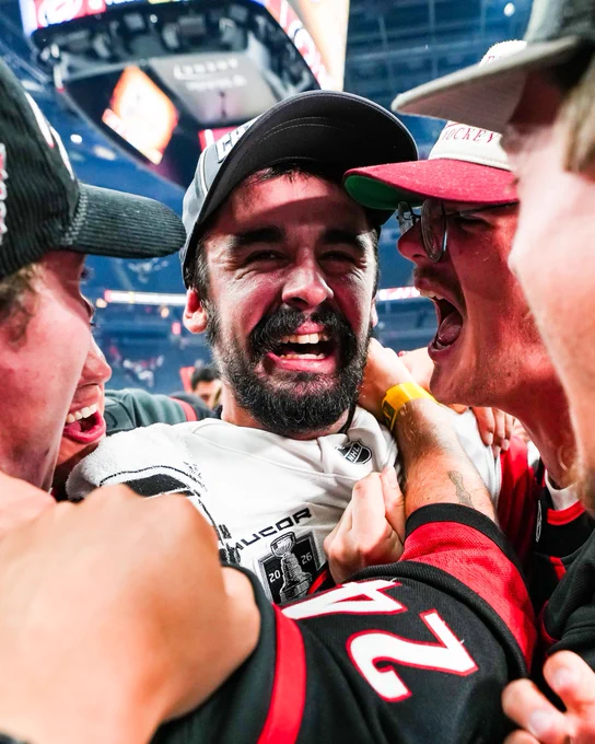 Seth Jarvis celebrating his Stanley Cup championshop with his friends on ice