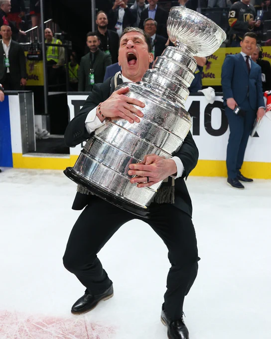 Photo of Rod Brind'Amour carrying the Stanley Cup