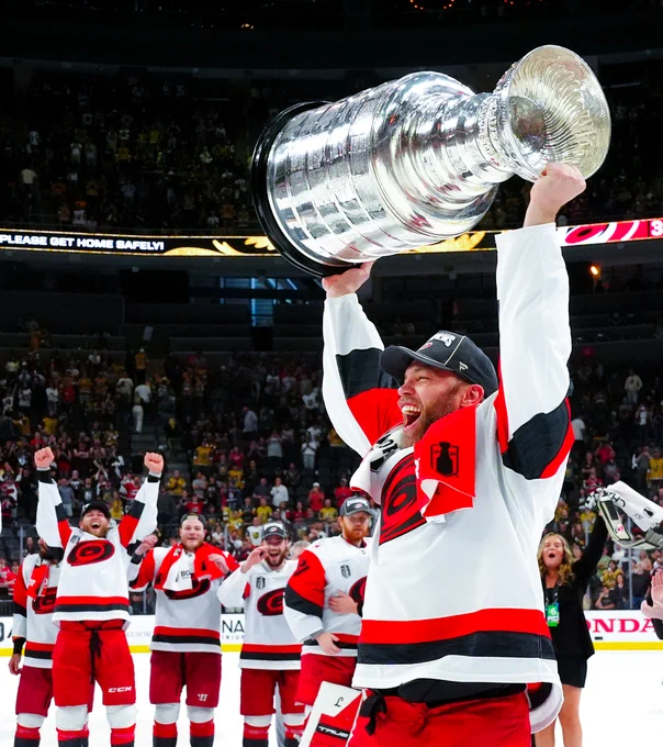 Photo of Taylor Hall hoisting the Cup