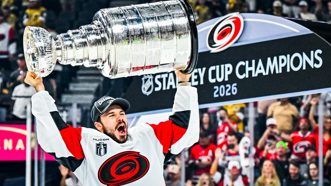 Photo of Logan Stankoven hoisting the Cup