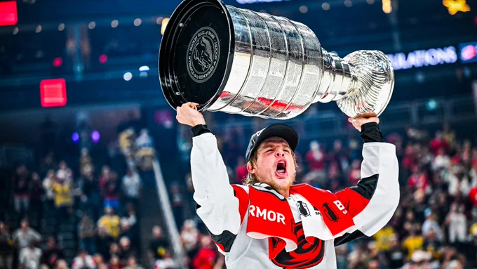 Photo of Jackson Blake hoisting the Cup