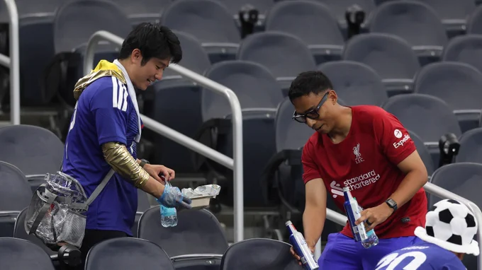 Japan fans tidy Dallas Stadium after their 2-2 draw with Netherlands