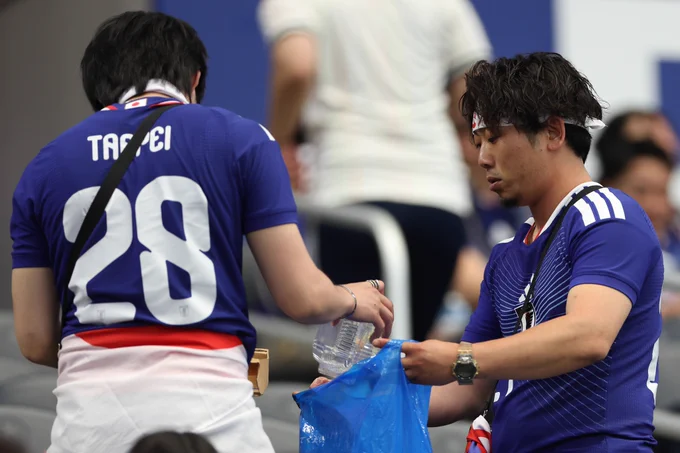 Japan fans tidy Dallas Stadium after their 2-2 draw with Netherlands