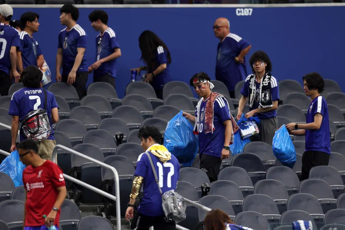Japan fans tidy Dallas Stadium after their 2-2 draw with Netherlands
