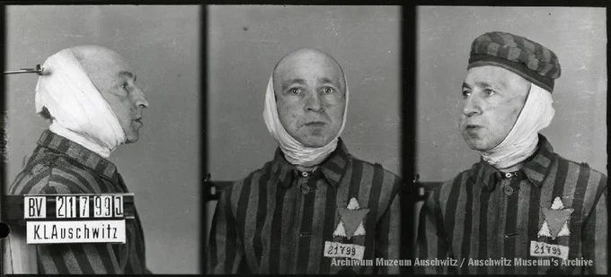 A mugshot registration photograph from Auschwitz. A man with a shaved head wearing a striped uniform photographed in three positions (profile and front with bare head and a photo with a slightly turned head with a hat on). The prisoner number is visible on a marking board on the left.