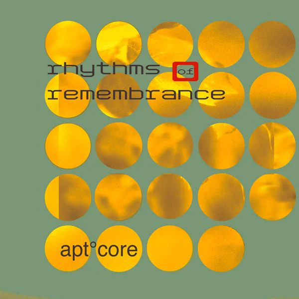 Album Art of apt.core's Rhythms Of Remembrance album - On a light green background, 24 circles are cut into it in rows of 5, and each hole has some sort of gold foil texture or something in it. On the bottom row, on top of the first two circles, it says 'apt.core', the artist name. And towards the top it says the album name, with the 'of' being smaller and having a red box around it.