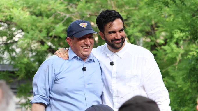 Standing and smiling with Mayor Zohran Mamdani.
