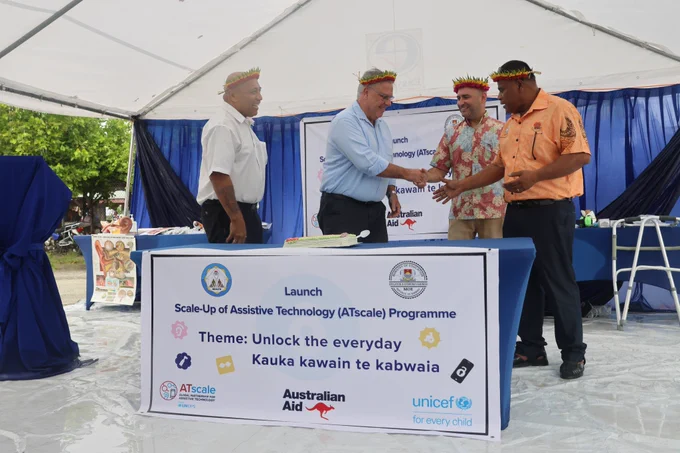 Honorable Botii Nauan, Minister of Health and Medical Services, His Excellency Mark Foxe, Australian High Commissioner to Kiribati, UNICEF Head of Office Nick Rice Chudeau, and Honorable Ruateki Tekaiara join hands on the occasion of the launch of the Assistive Technology (AT) Programme launch in Kiribati.