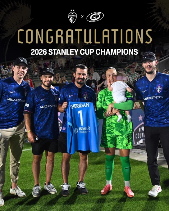 Carolina Hurricanes at a Courage match with text “Congratulations 2026 Stanley Cup Champions”