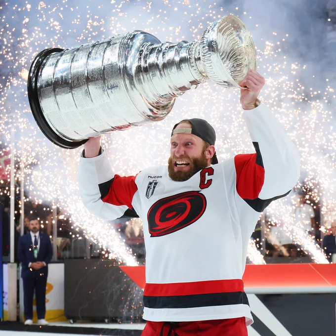 Photo of Jordan Staal raising the cup 
