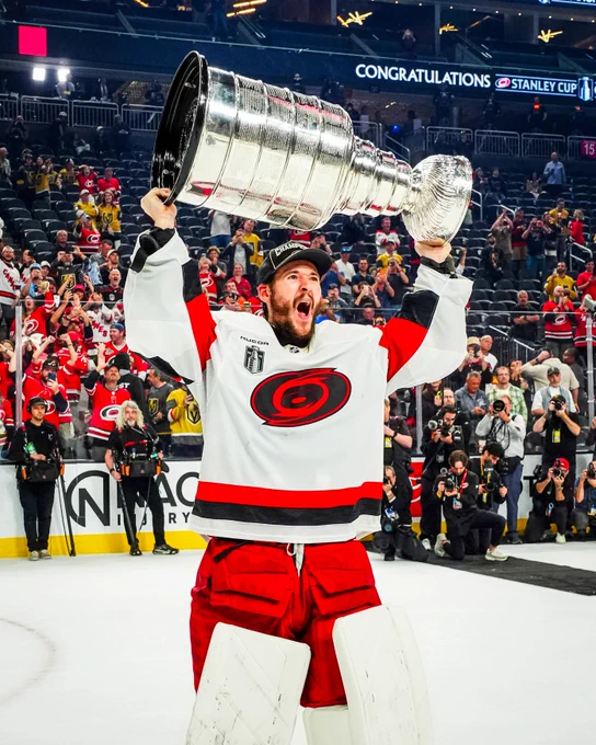 Photo of Brandon Bussi hoisting the Cup