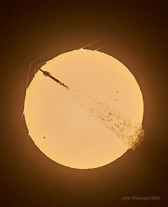 What's happening to this Sun-crossing rocket? The SpaceX Falcon 9 rocket, visible on the upper left, launched only about one minute before this amazing image was captured. As it rose to low Earth orbit from Cape Canaveral, Florida, USA, in late May, the rocket became supersonic before it crossed the disk of the distant Sun -- from the perspective of the well-placed photographer. The spacecraft's high speed caused bow-shaped compressed-air shockwaves to form across leading surfaces, with at least three visible even outside the Sun's disk because they refract sunlight. The trailing exhaust caused turbulence visible on the lower right. None of this was damaging to the robotic Starlink 10-53 mission, which delivered 29 communications satellites to low Earth orbit as planned. And if that isn't amazing enough - the Sun had spots!