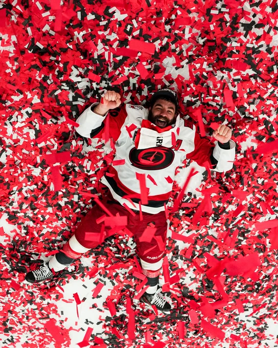 Photo of Jordan Martinook in a Carolina Hurricanes uniform in confetti