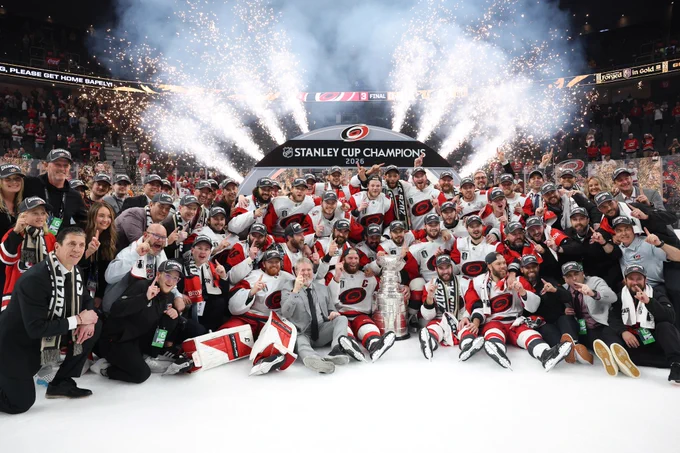 The Carolina Hurricanes pose after winning the 2026 Stanley Cup.