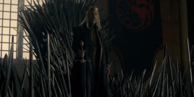 King Viserys I Targaryen holding Blackfyre, the ancestral Valyrian steel bastard sword of House Targaryen.