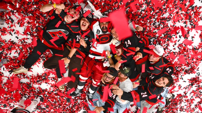 Photo of Seth Jarvis and his friends laying in confetti 