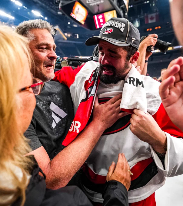Photo of Seth Jarvis crying with his family after the Stanley Cup win