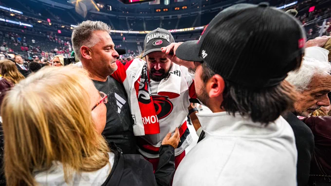 Photo of Seth Jarvis crying with his family after the Stanley Cup win