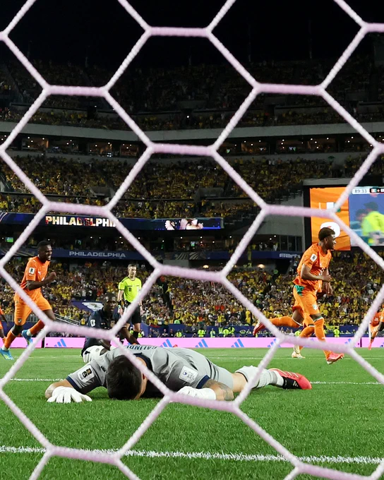 Amad celebrates his goal for Ivory Coast v Ecuador at the World Cup.