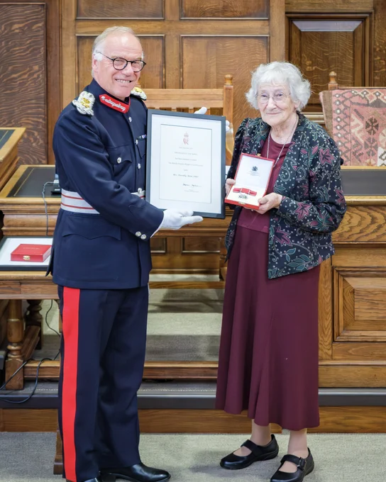 HM Lord-Lieutenant of Northamptonshire, James Saunders Watson Esq presenting Mrs. Anne Ford with her British Empire Medal (BEM) for her services to Northampton Community