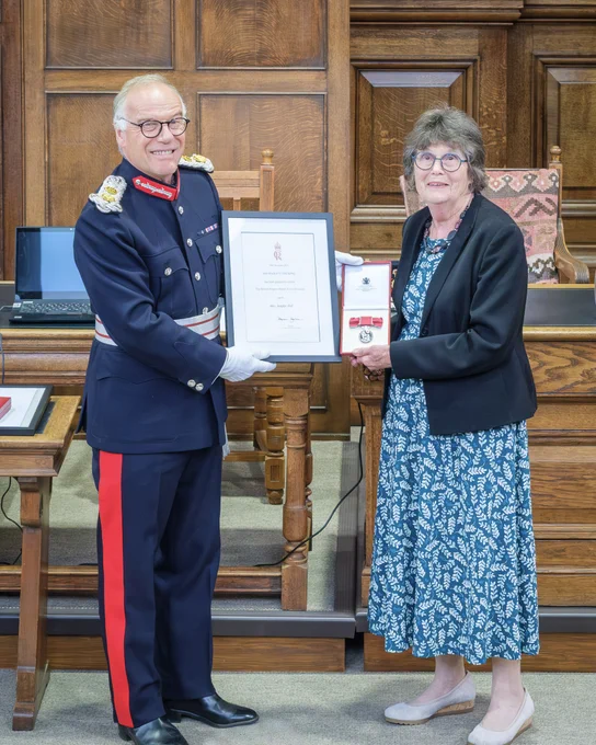 HM Lord-Lieutenant of Northamptonshire presenting Mrs. Jenifer Fell with her British Empire Medal 