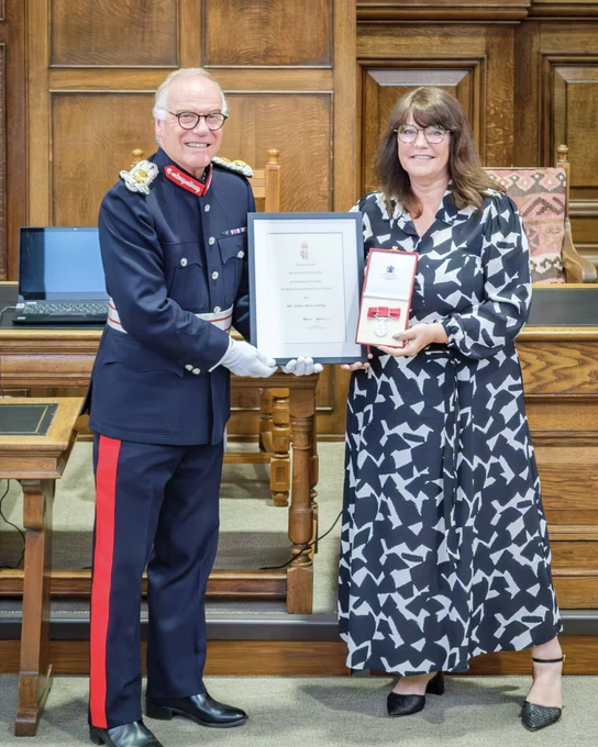 HM Lord-Lieutenant of Northamptonshire, James Saunders Watson Esq  with Mrs. Debra Scotting being presented with her BEM.
