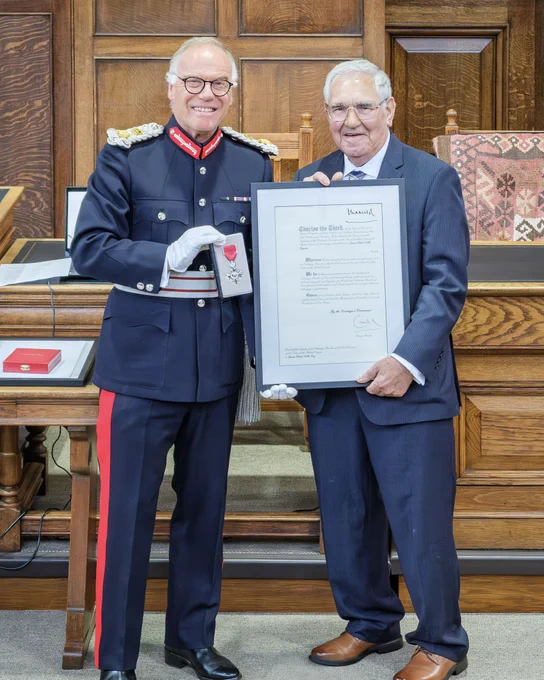 HM Lord-Lieutenant of Northamptonshire, James Saunders Watson Esq presenting Mr. James Noble with his MBE