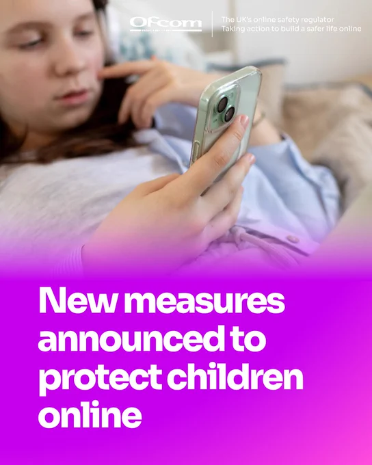 A child holding a smartphone while lying down, highlighting new online safety measures to protect children.